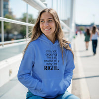 Load image into Gallery viewer, Woman wearing a blue hoodie with text, sitting outdoors on a sunny day.
