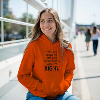 Load image into Gallery viewer, Woman wearing an orange hoodie with text, sitting outdoors on a sunny day.
