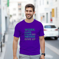 Load image into Gallery viewer, Man wearing a purple t-shirt with motivational text on a city street
