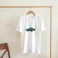 Load image into Gallery viewer, White t-shirt with a blue car graphic on a wooden hanger against a beige wall.
