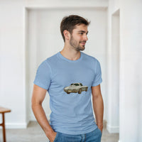Load image into Gallery viewer, Man wearing a light blue t-shirt with a car graphic in a minimalistic room.
