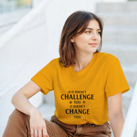 Load image into Gallery viewer, Woman wearing a mustard yellow t-shirt with a motivational quote, sitting on steps.
