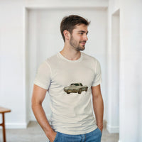 Load image into Gallery viewer, Man wearing a beige t-shirt with a car graphic in a minimalistic room.

