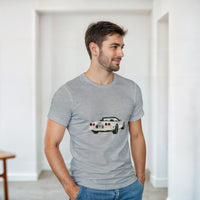 Load image into Gallery viewer, Man wearing a gray t-shirt with a car graphic in a minimalistic room.
