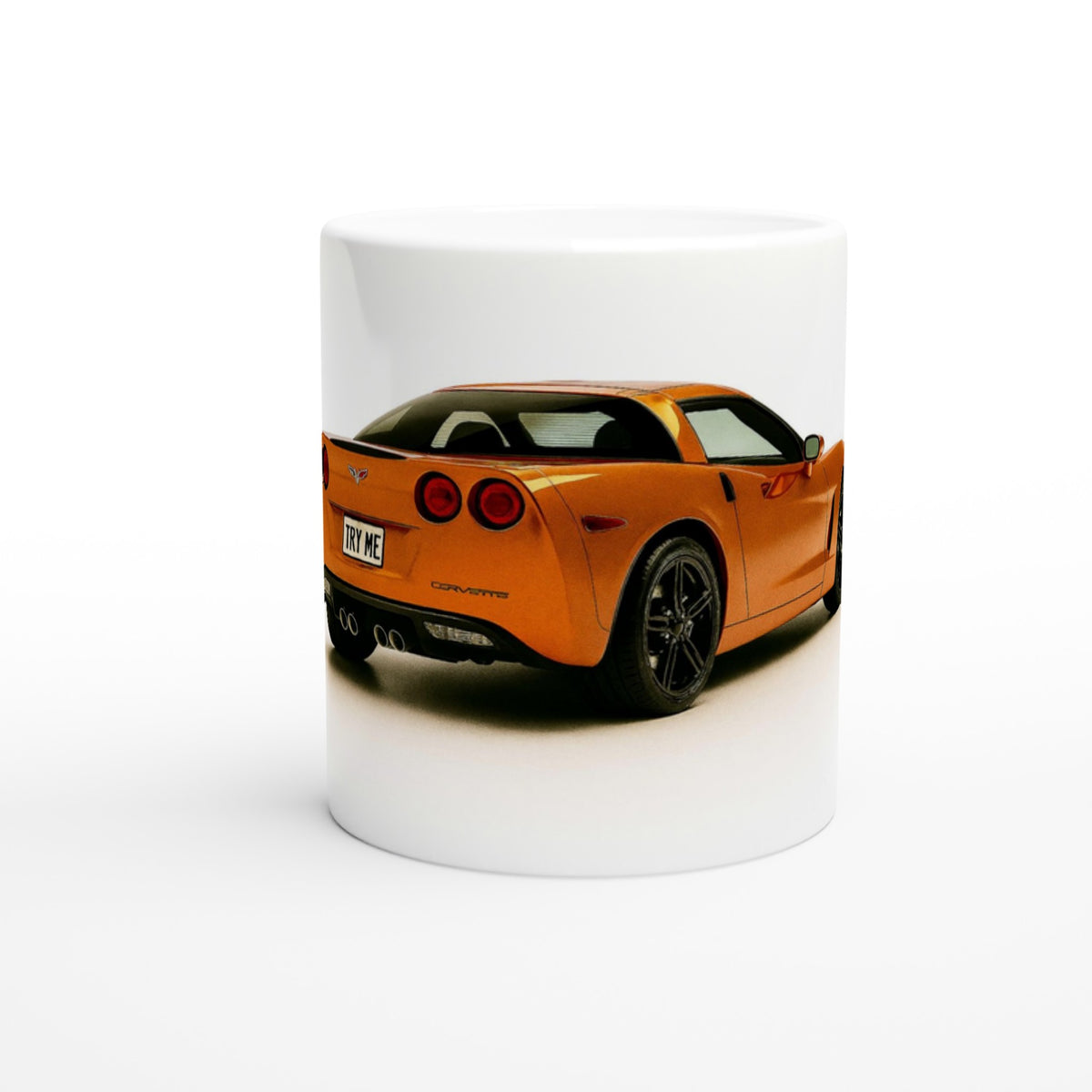 White mug with an orange sports car design on a white background