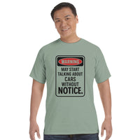 Load image into Gallery viewer, Man wearing a light green t-shirt with a humorous warning design on a white background

