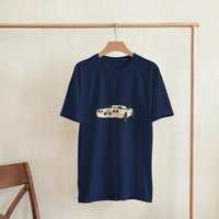 Load image into Gallery viewer, Navy blue t-shirt with a car graphic on a wooden hanger against a beige wall.
