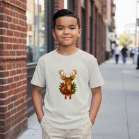 Load image into Gallery viewer, Child wearing a white t-shirt with a reindeer design on a city street.
