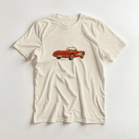 Load image into Gallery viewer, Beige t-shirt with a red vintage car graphic on a light gray background
