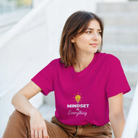 Load image into Gallery viewer, Woman wearing a pink t-shirt with &#39;MINDSET is Everything&#39; text and light bulb graphic.
