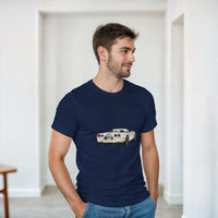 Load image into Gallery viewer, Man wearing a navy blue t-shirt with a car graphic in a minimalistic room.
