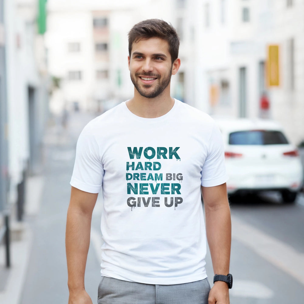 Man wearing a white t-shirt with motivational text on a city street