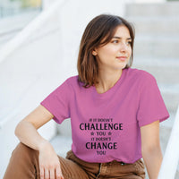 Load image into Gallery viewer, Person wearing a pink t-shirt with a motivational quote, sitting outdoors.
