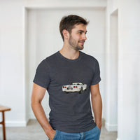 Load image into Gallery viewer, Man wearing a dark gray t-shirt with a car graphic in a minimalistic room.
