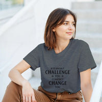 Load image into Gallery viewer, Woman wearing a gray t-shirt with a motivational quote, sitting outdoors.
