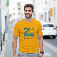 Load image into Gallery viewer, Man wearing a yellow t-shirt with motivational text on a city street
