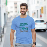 Load image into Gallery viewer, Man wearing a blue t-shirt with motivational text on a city street
